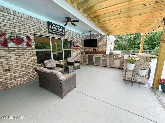 view of patio / terrace with an outdoor hangout area, grilling area, an outdoor kitchen, and ceiling fan