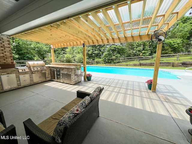 view of swimming pool with a patio area, area for grilling, and a pergola