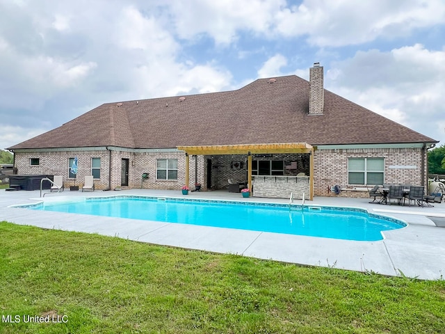 view of swimming pool with a patio area and a lawn