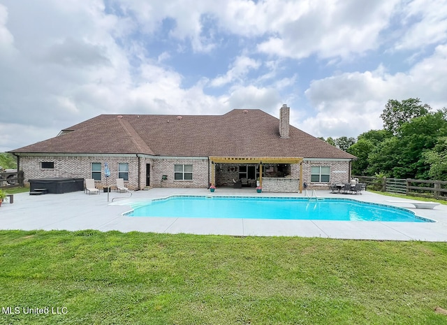 view of swimming pool with a hot tub, a yard, a diving board, and a patio