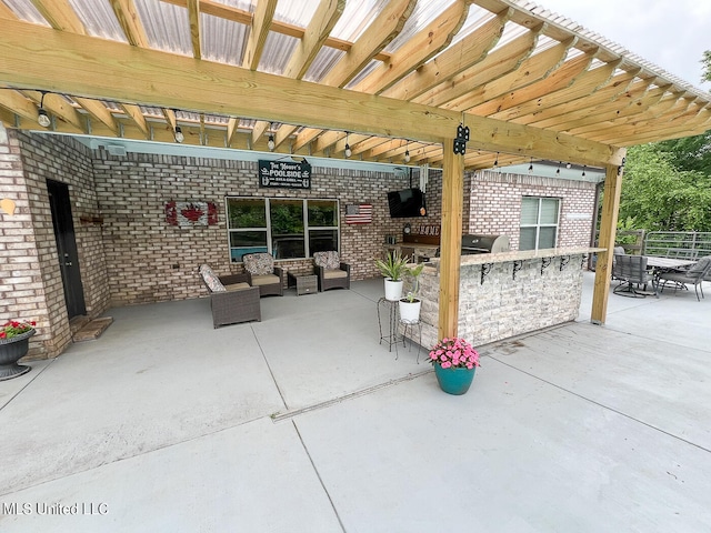 view of patio / terrace featuring a pergola and area for grilling