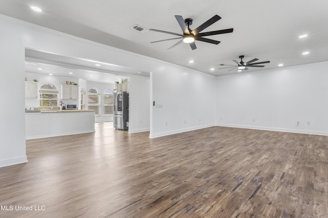 10186 Wire Rd, Vancleave, MS 39565 - unfurnished living room featuring recessed lighting, ceiling fan, wood finished floors, crown molding, and baseboards