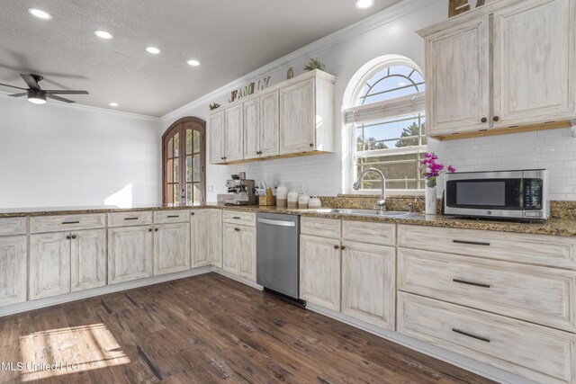 10186 Wire Rd, Vancleave, MS 39565 - kitchen featuring appliances with stainless steel finishes, crown molding, a sink, a ceiling fan, and plenty of natural light