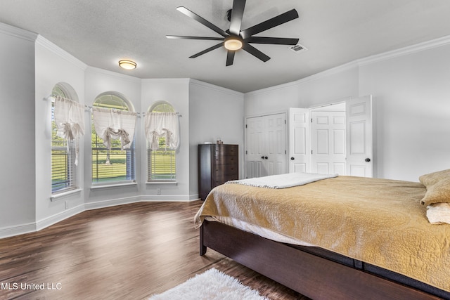 10186 Wire Rd, Vancleave, MS 39565 - bedroom featuring wood finished floors, crown molding, baseboards, and a ceiling fan