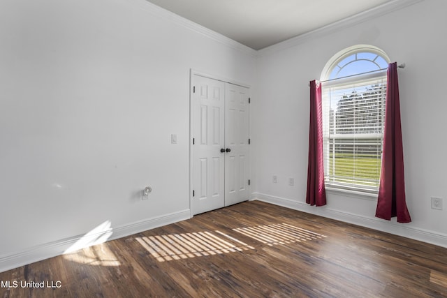 10186 Wire Rd, Vancleave, MS 39565 - unfurnished room with wood finished floors, crown molding, healthy amount of natural light, and baseboards