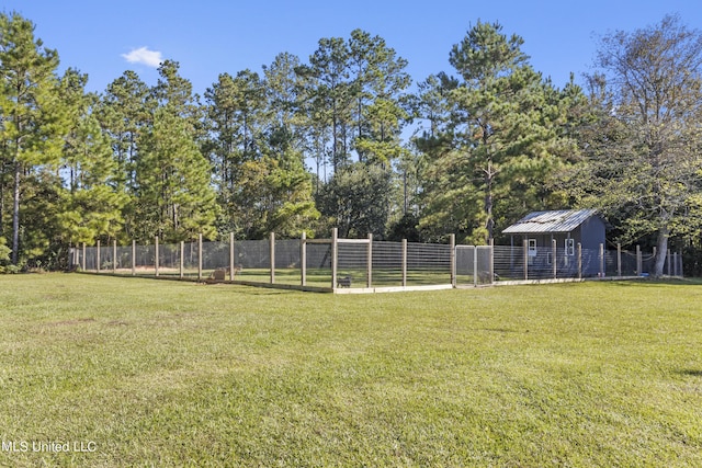 10186 Wire Rd, Vancleave, MS 39565 - view of yard with an outdoor structure and view of wooded area