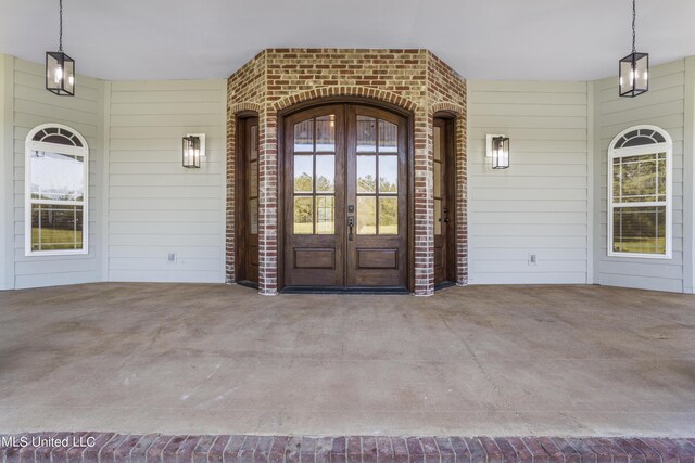 10186 Wire Rd, Vancleave, MS 39565 - doorway to property featuring french doors and brick siding
