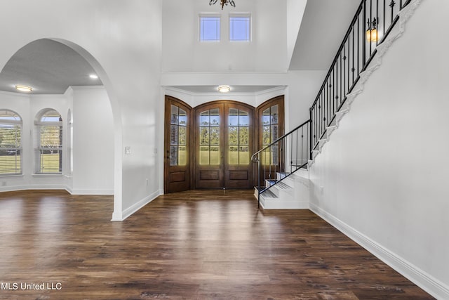 10186 Wire Rd, Vancleave, MS 39565 - foyer with a towering ceiling, baseboards, healthy amount of natural light, and wood finished floors