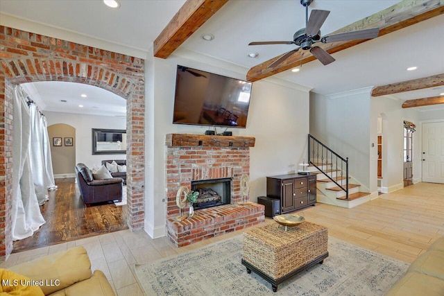 105 Victoria Pl, Madison, MS 39110 - living area with beam ceiling, stairway, arched walkways, wood finished floors, and ceiling fan