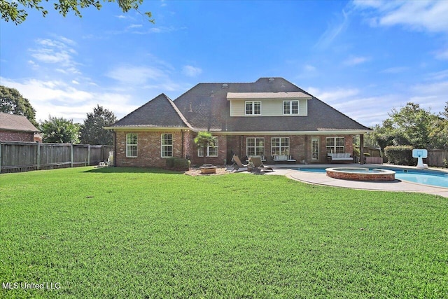105 Victoria Pl, Madison, MS 39110 - back of house with brick siding, a fenced backyard, a patio area, and a pool with connected hot tub
