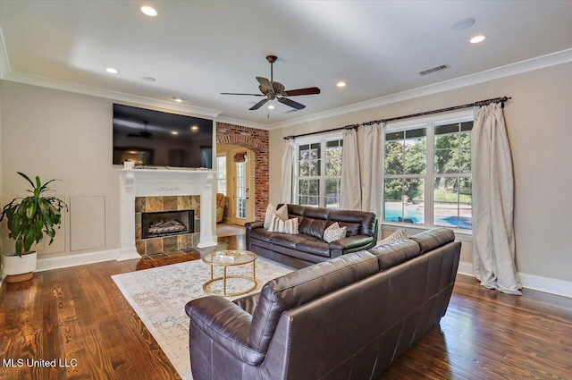 105 Victoria Pl, Madison, MS 39110 - living area featuring a ceiling fan, wood finished floors, a tiled fireplace, ornamental molding, and recessed lighting