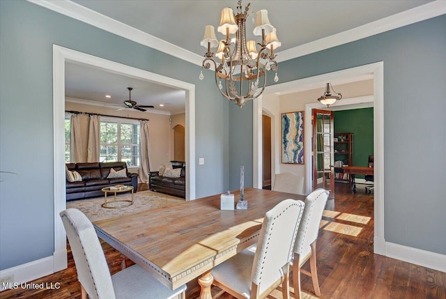105 Victoria Pl, Madison, MS 39110 - dining room with arched walkways, crown molding, dark wood-style floors, and a chandelier