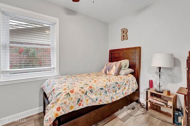 bedroom featuring ceiling fan and wood-type flooring