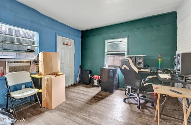 office with hardwood / wood-style flooring and cooling unit