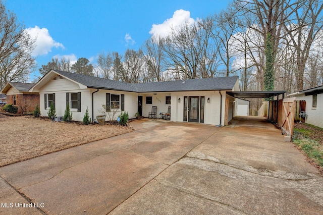 ranch-style home with a carport