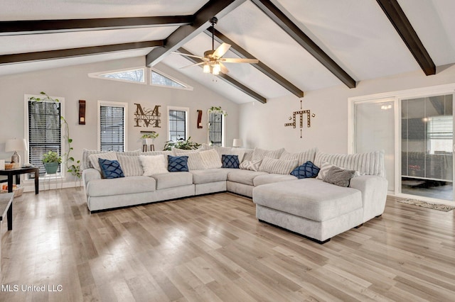 living room with ceiling fan, a healthy amount of sunlight, lofted ceiling with beams, and light hardwood / wood-style flooring