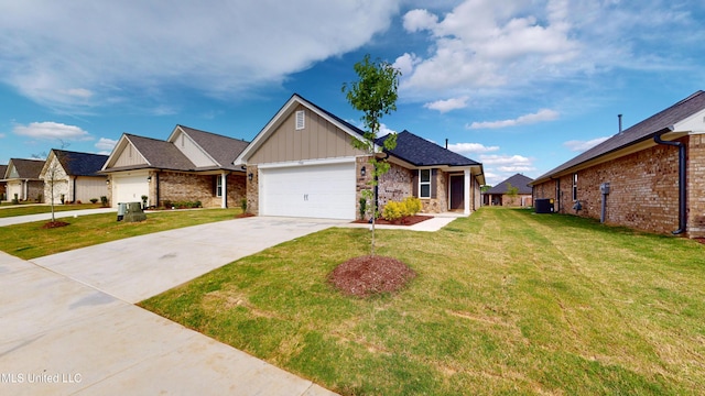 7908 Gardendale Dr, Olive Branch, MS 38654 - view of front facade featuring driveway, a garage, a front lawn, and board and batten siding