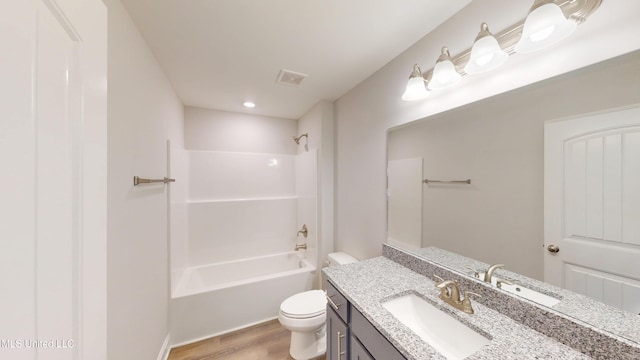 7908 Gardendale Dr, Olive Branch, MS 38654 - full bathroom with toilet, wood finished floors, shower / bath combination, visible vents, and vanity