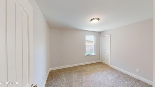 7908 Gardendale Dr, Olive Branch, MS 38654 - carpeted spare room featuring baseboards