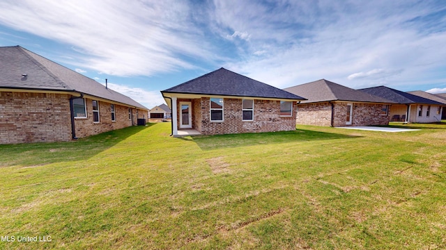 7908 Gardendale Dr, Olive Branch, MS 38654 - back of property with a yard, a patio, and brick siding