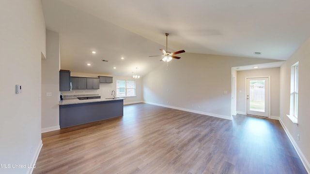 7908 Gardendale Dr, Olive Branch, MS 38654 - kitchen with a sink, open floor plan, gray cabinets, ceiling fan, and vaulted ceiling