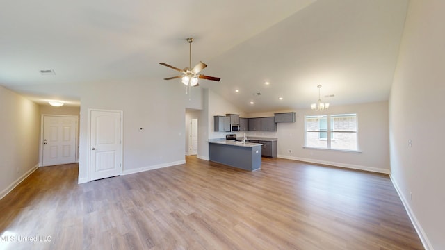 7908 Gardendale Dr, Olive Branch, MS 38654 - kitchen with gray cabinetry, stainless steel microwave, baseboards, and open floor plan