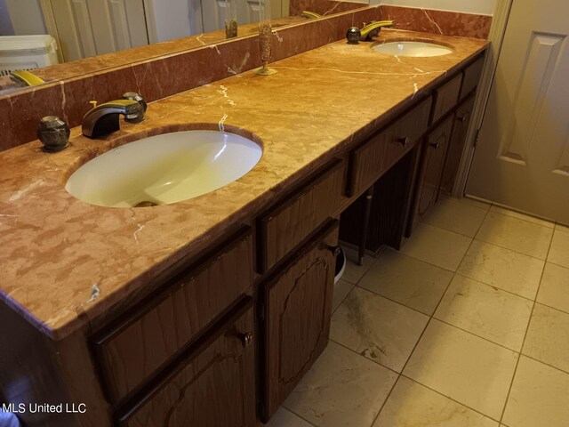 bathroom with vanity and tile patterned floors