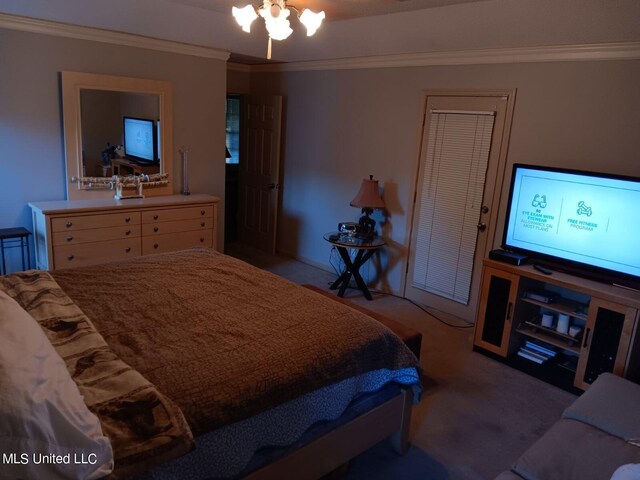 carpeted bedroom featuring ornamental molding and a closet