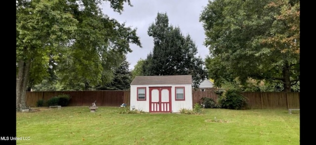 view of outbuilding with a yard