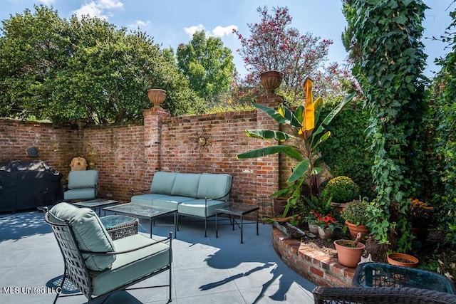 view of patio featuring area for grilling and an outdoor hangout area