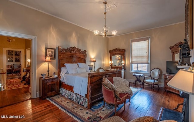 bedroom with a chandelier, crown molding, and dark wood-type flooring