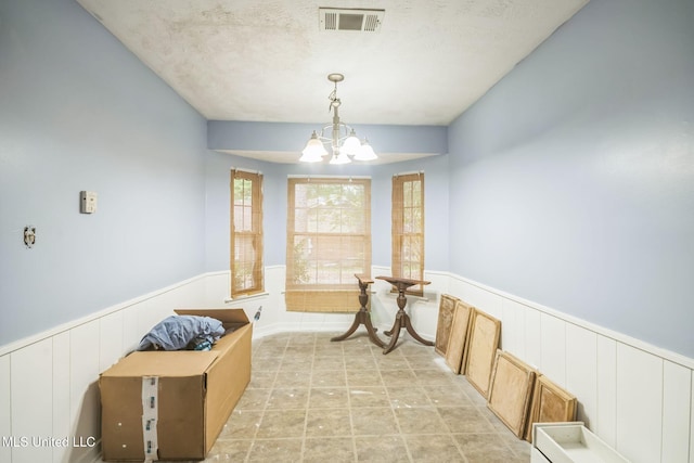 108 Fairdale Pl, Brandon, MS 39042 - dining area with a wainscoted wall and a chandelier
