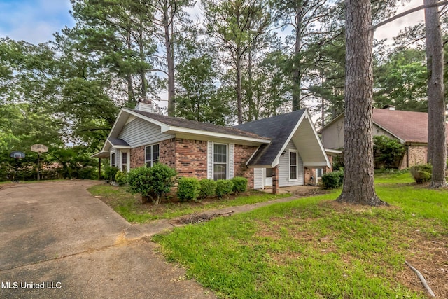 108 Fairdale Pl, Brandon, MS 39042 - view of front of property with brick siding, a chimney, and concrete driveway