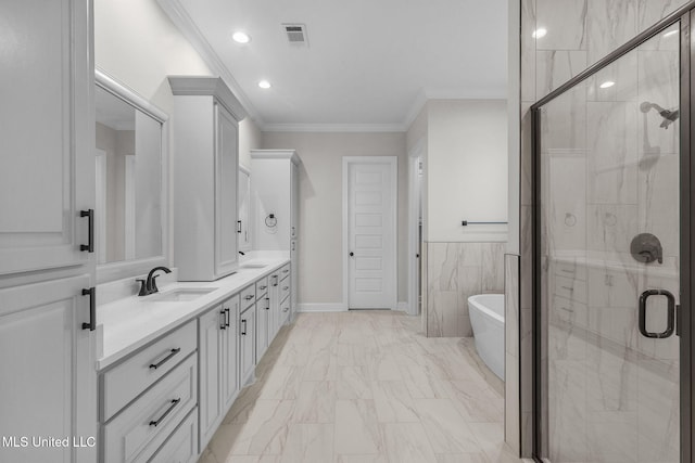 bathroom with vanity, crown molding, independent shower and bath, and tile walls