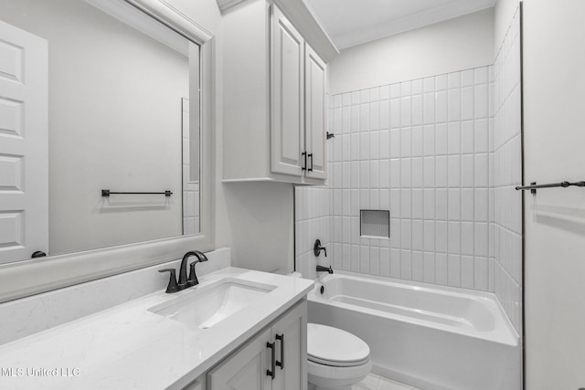 full bathroom featuring vanity, tiled shower / bath combo, and toilet