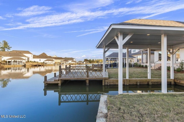 dock area featuring a yard and a water view