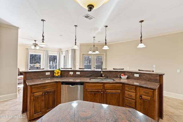 kitchen featuring dishwasher, light tile patterned floors, a sink, and visible vents