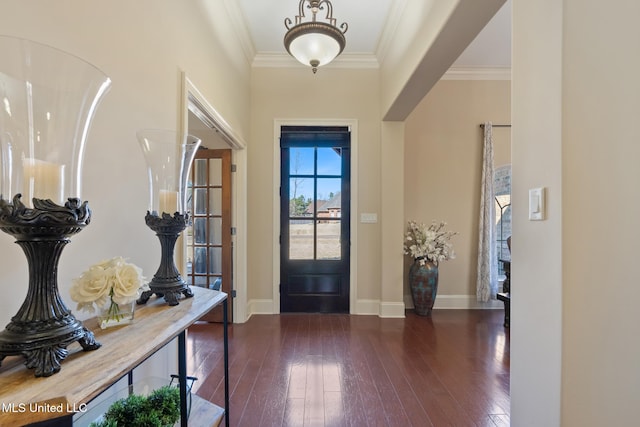 foyer with baseboards, ornamental molding, and dark wood-style flooring