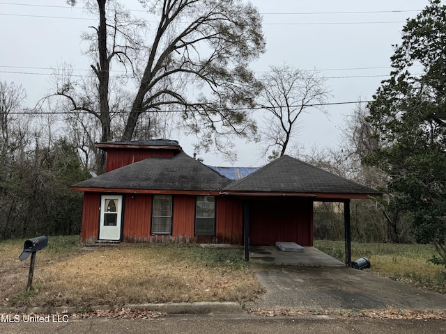 2920 Miller Ave, Natchez, MS 39120 - view of front of property featuring an attached carport, a shingled roof, and driveway