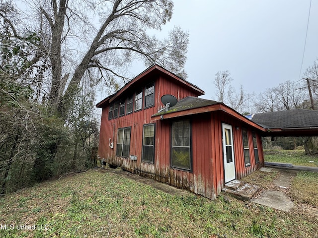 2920 Miller Ave, Natchez, MS 39120 - view of property exterior with a carport and a yard