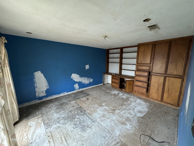 2920 Miller Ave, Natchez, MS 39120 - unfurnished bedroom featuring a textured ceiling and baseboards