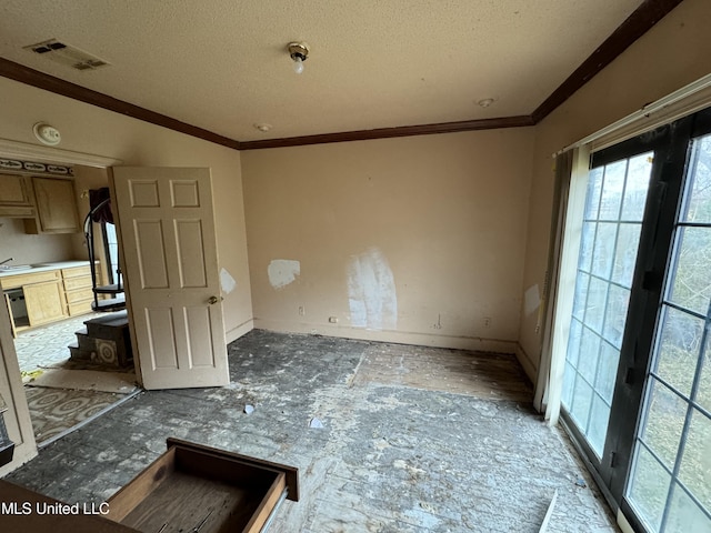 2920 Miller Ave, Natchez, MS 39120 - empty room featuring a textured ceiling, crown molding, and a sink