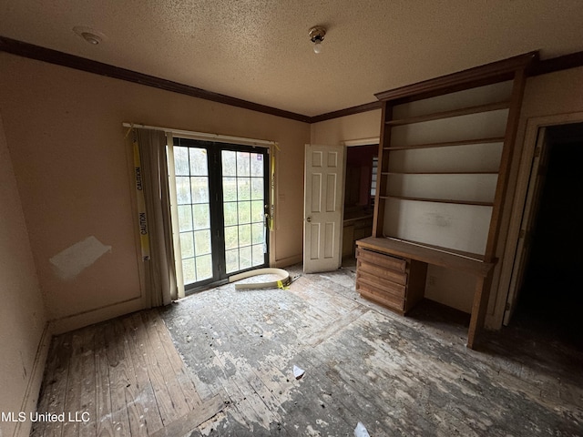 2920 Miller Ave, Natchez, MS 39120 - unfurnished bedroom featuring crown molding, access to outside, a textured ceiling, and wood finished floors