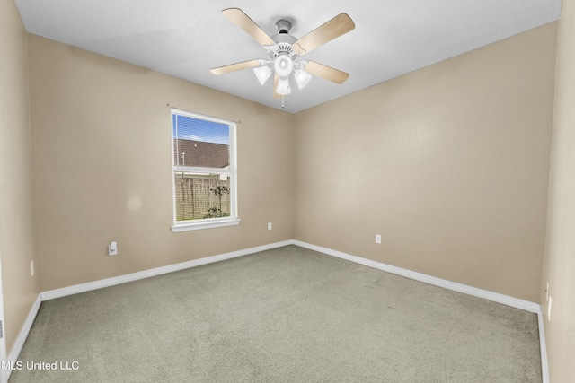 carpeted empty room featuring ceiling fan