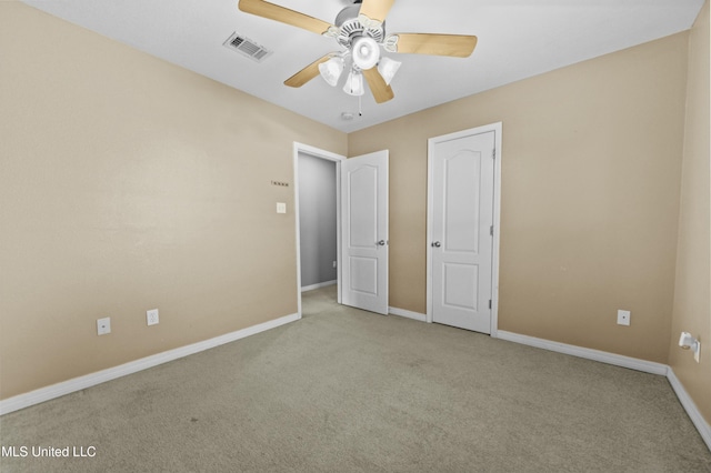 unfurnished bedroom with ceiling fan and light carpet