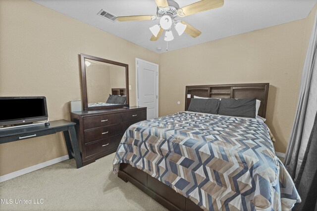 bedroom with ceiling fan and light colored carpet