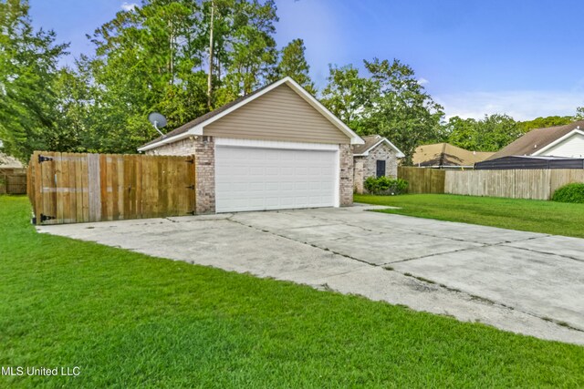 garage featuring a yard