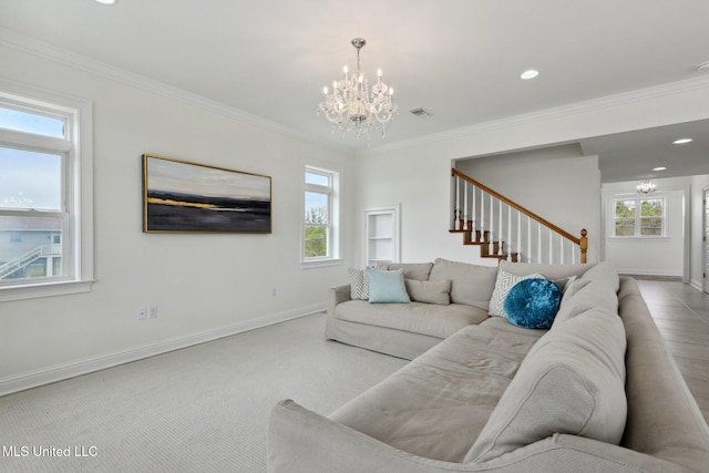 carpeted living room with crown molding and a notable chandelier