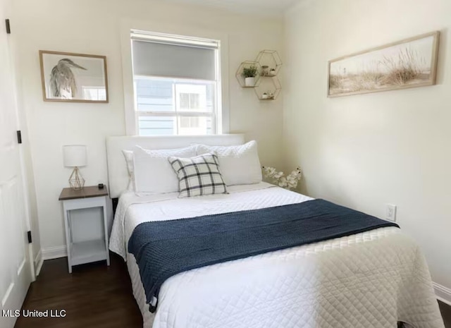 bedroom featuring dark hardwood / wood-style flooring