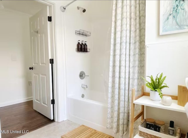 bathroom with hardwood / wood-style floors and shower / bath combo